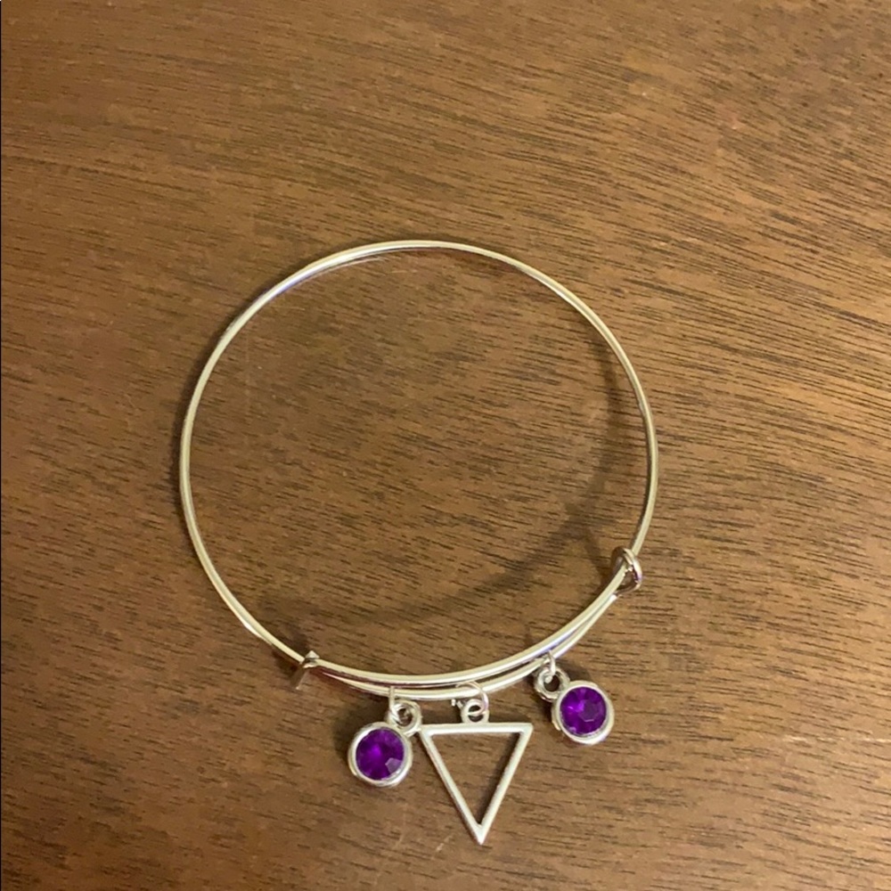 A purple triangle bracelet .